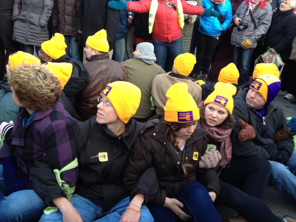 Hornstein, Pisel, Thomas and Mielke refusing to leave the bridge prior to their arrest. Photo by Sarah Knispel ’15