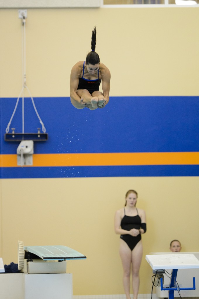 Renee Jordan ‘14 dives at Riley Pool on January 12 en route to first place finishes in the 1-meter and 3-meter dives. Jordan capped off her season with eighth and ninth place finishes at the Division III National Championships in Shenandoah, Texas. Photo Credit: Christopher Mitchell / SportShotPhoto.com