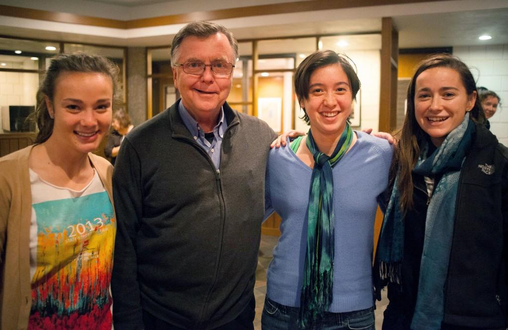 From left: Caroline Wright ’16, Fr. Bob O’Donnell, CSP, Caitlin Toner ’15, and Ellen Brady ’15 at a farewell reception for O’Donnell, held Tuesday in the CRSL. O’Donnell was reassigned over the summer.