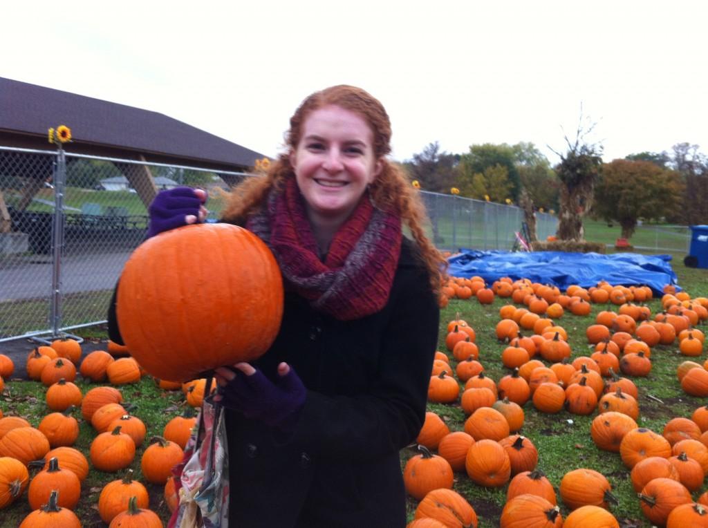 Roving Reporter Amy Lebowitz poses with newly acquired pumpkin Audre Gourde at a local suburban park/pumpkin patch.