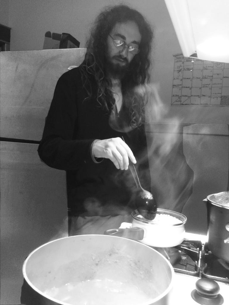 Kyle in his unnatural habitat, cooking house dinner this week which consisted of two recipes from the Trinity Presbyterian Church Cookbook.  Photo by Alex Bentz ’14