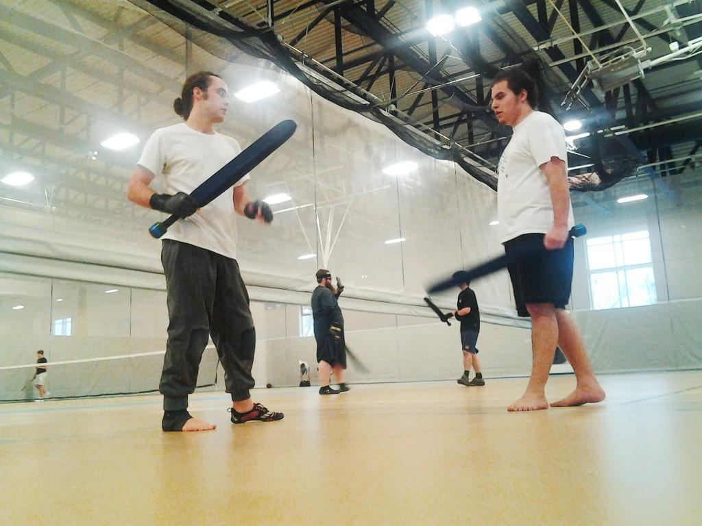 AJ Zozulin ’14 (left), who helped found Mac’s Dagorhir club after starting a similar group at his high school, holds a fighting stance in a Saturday afternoon practice.
Waabanang Hermes  ’17 (right), is about to embark in a practice duel.
