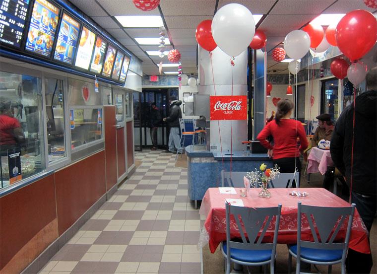 Balloons, tablecloths, and place settings elevate the atmosphere in a White Castle for Valentine’s Day.  Photo courtesy of http://theeatenpath.com