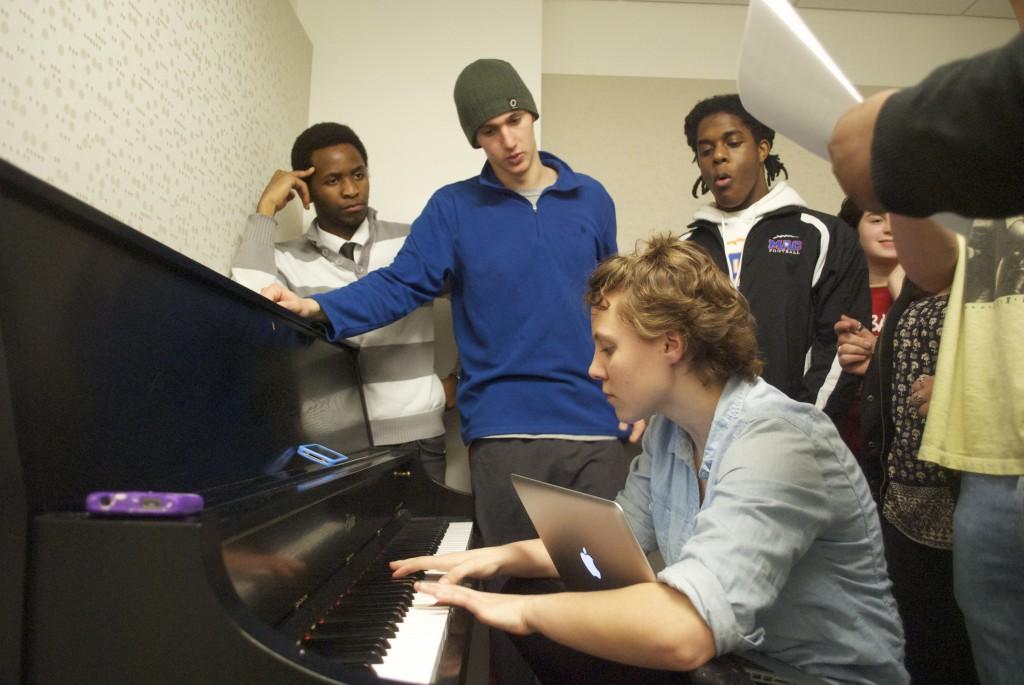 Chromactics members Peace Madimutsa, Ben Haltmaier and Hannah Field work on their R&B arrangements. The Chromactics are Macalester’s fifth a cappella organization, and formed earlier this year. Photo by Joe Bermas-Dawes ’17. 
