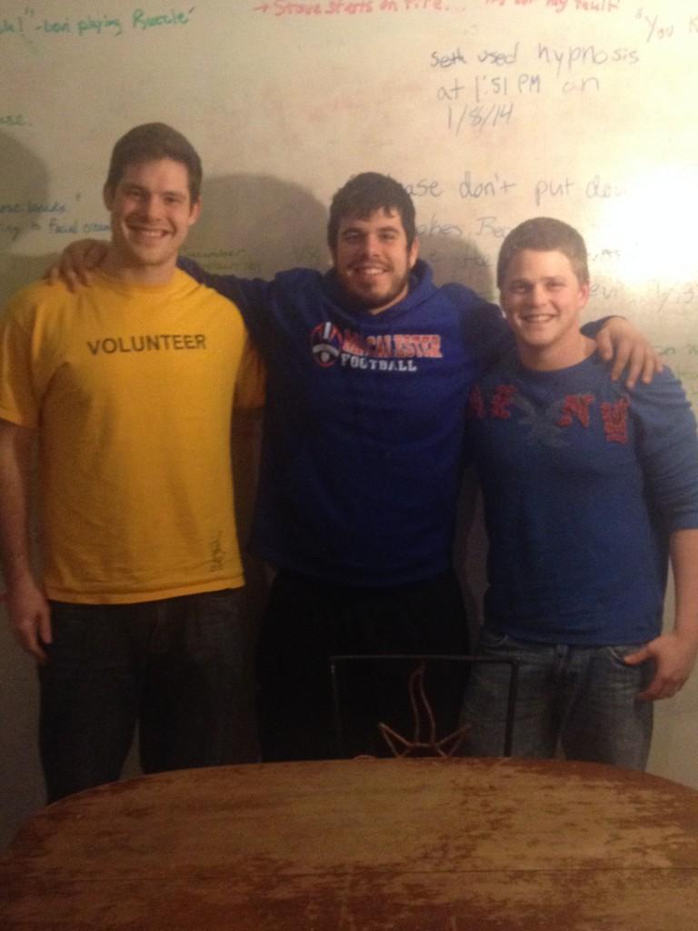 Ben Conlon, Adam Bauer and Levi Brown (L to R) show off their in-house quote wall. Photo by David Lopez ’14.