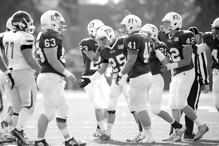 Dykema at the center of the defensive huddle during a game against Trinity Bible College. Photo courtesy of Christopher Mitchell.