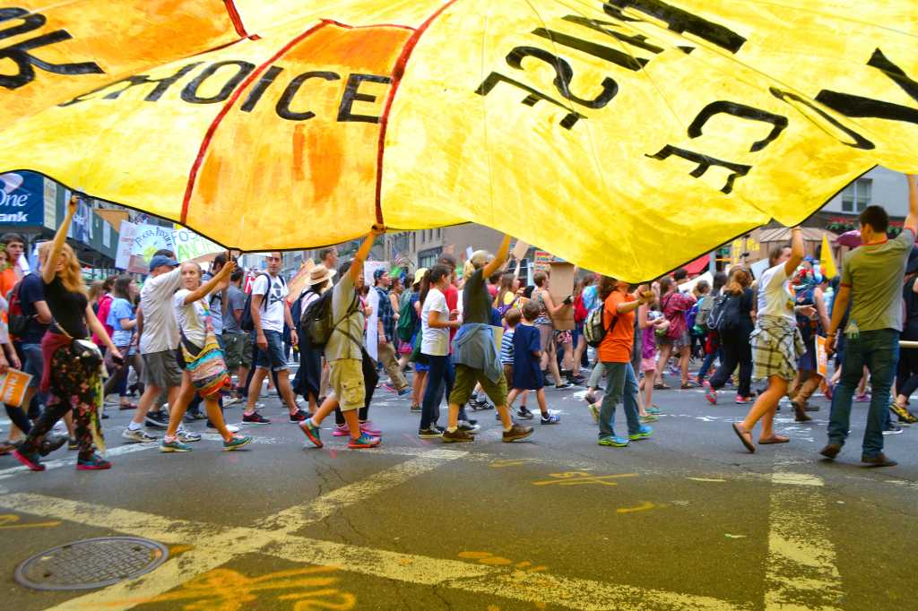 Students carry a parachute during the Peoples Climate March in New York City in Sunday. Photo by Celia Heudebourg18.