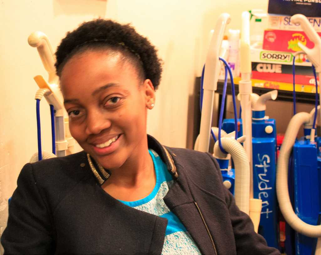 Caroline Chinhuru17, RA of Doty 4, works in the Doty Hall Office while on call. She enjoys the extra insight she gets into peoples lives as an RA. Photo by Thao Hoang18.