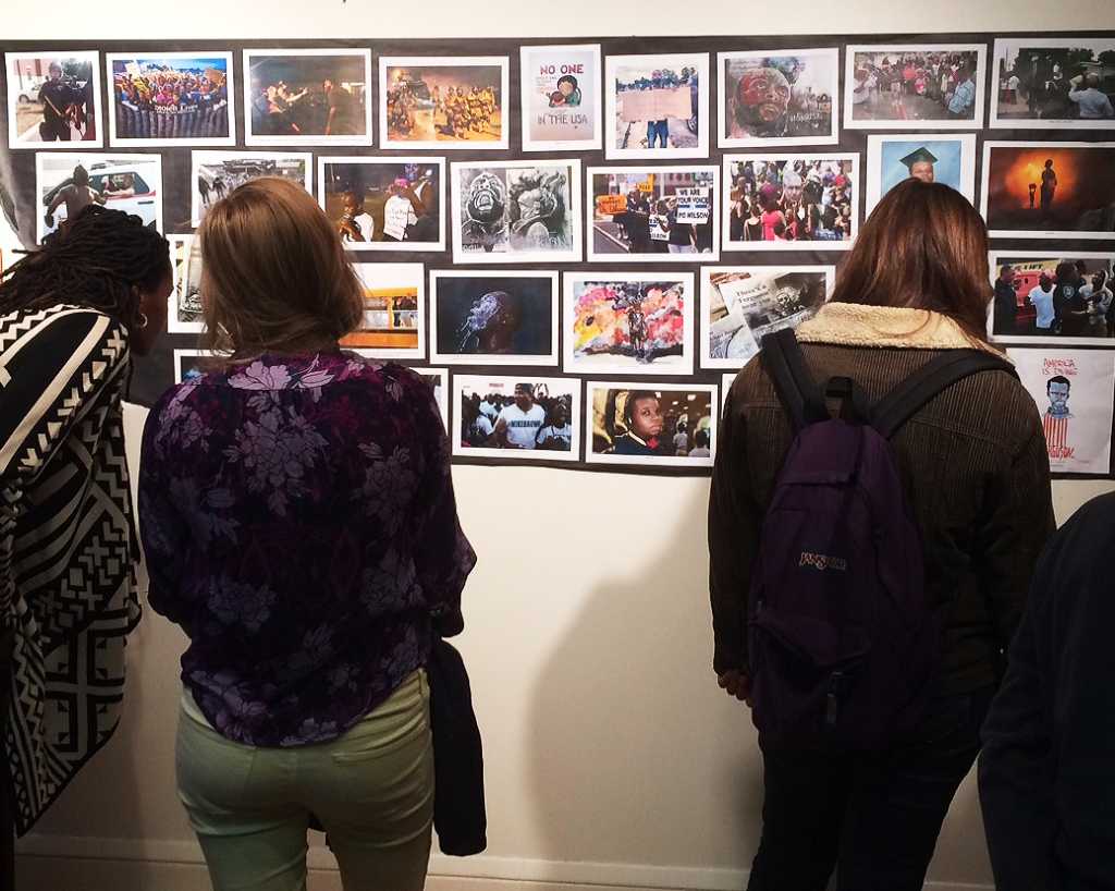 Mural of photos at the Cultural Houses Ferguson event. Photo by Allie Korbey17.