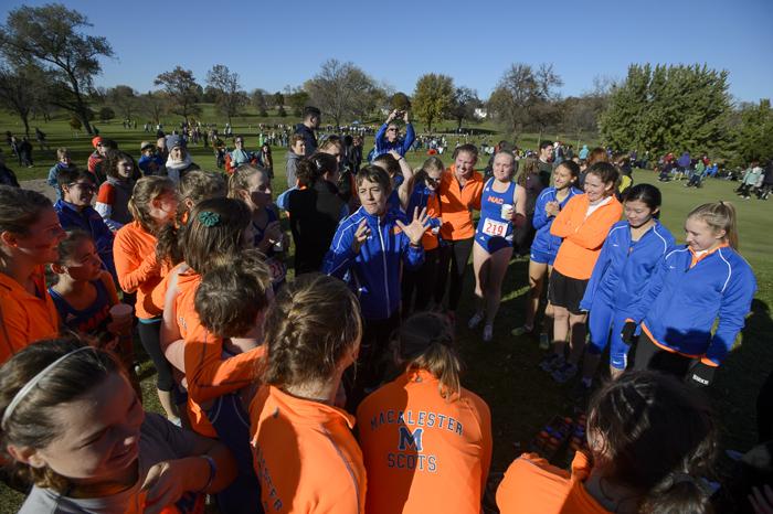 Head Coach Betsy Emerson speaks to Womens Cross Country team after the 2013 MIAC Championships in which Mac finished fourth. Photo courtesy of Christopher Mitchell.