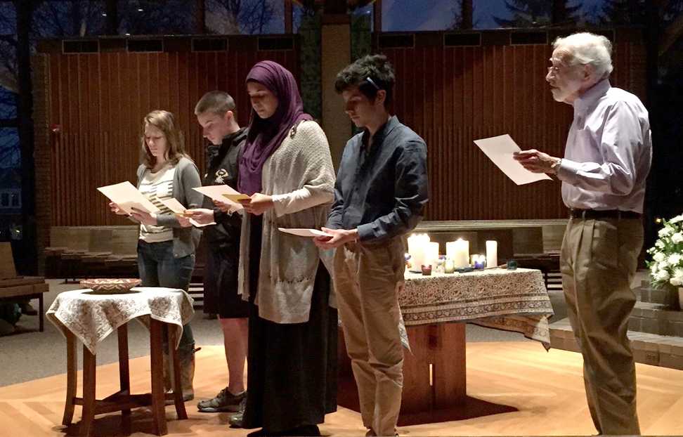 Students read a prayer for the victims of the attacks and others in the minds of the Macalester community.  The prayer took place at a vigil that was held Monday, Nov. 16, by the Center for Religious and Spiritual Life. *Photo courtesy of Denise Ward.*