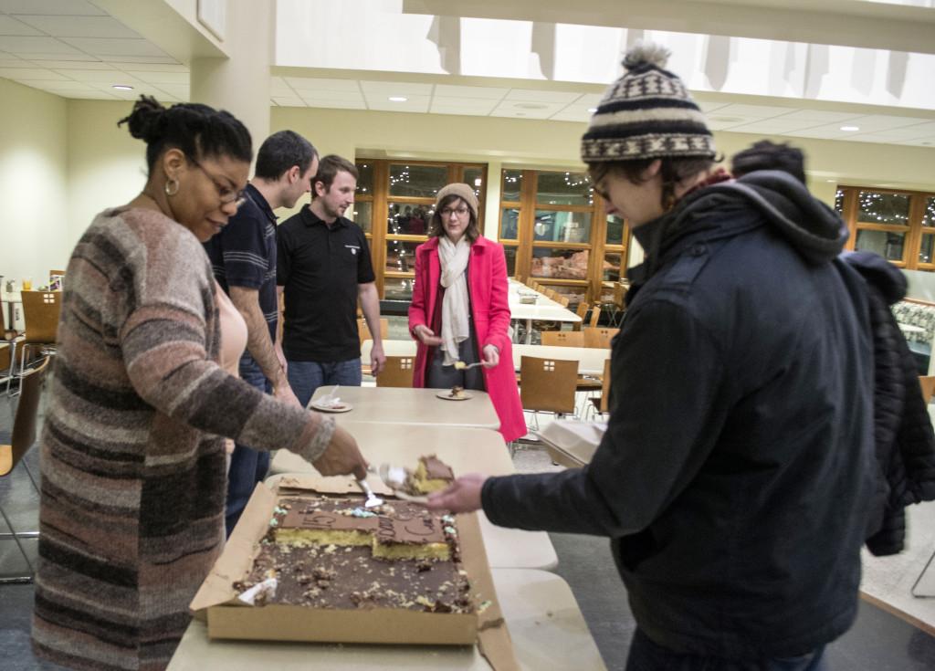 Director of Campus Activities and Operations Joan Maze serves cake to students for the Campus Center 15th Birthday. Photo by Will Milch.