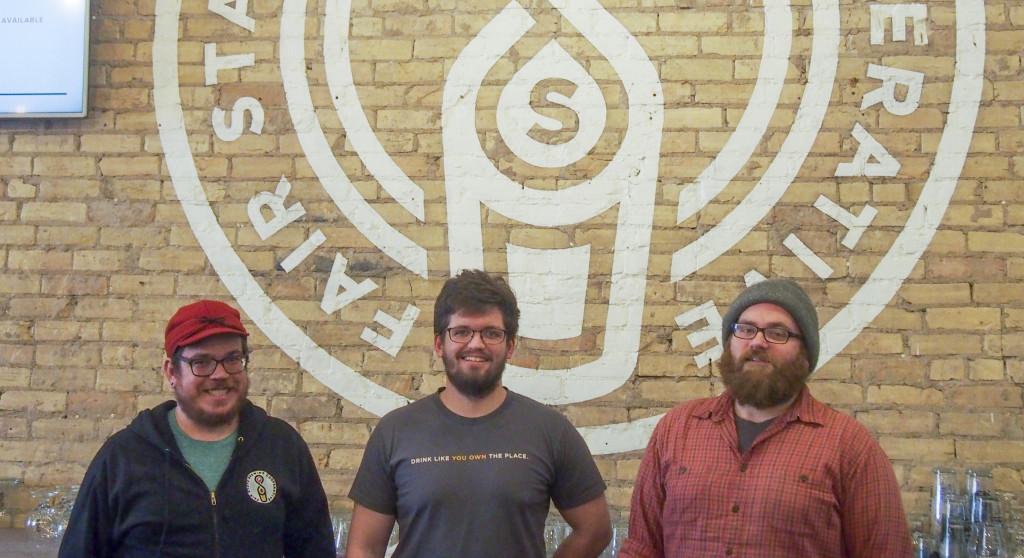 The Fair State taproom with its three co-founders: Matt Hauck ’06, Evan Sallee and Niko Tonks. Photo by Jesse Meisenhelter ’16.