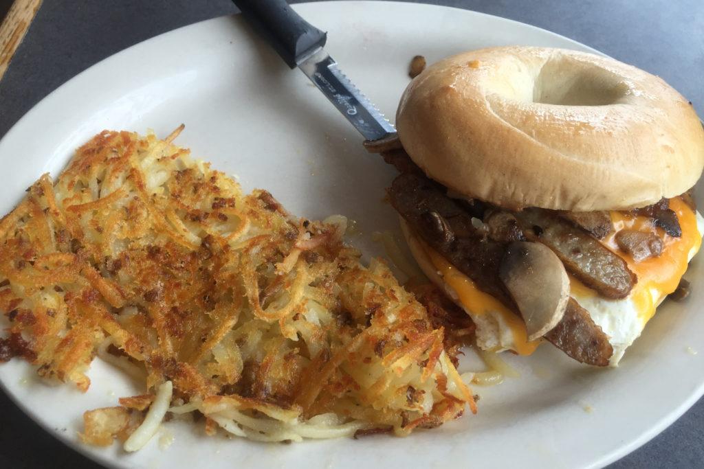 The Neighborhood Café breakfast sandwich with American cheese and sausage on a bagel. Photo by Joe Klein ’16.