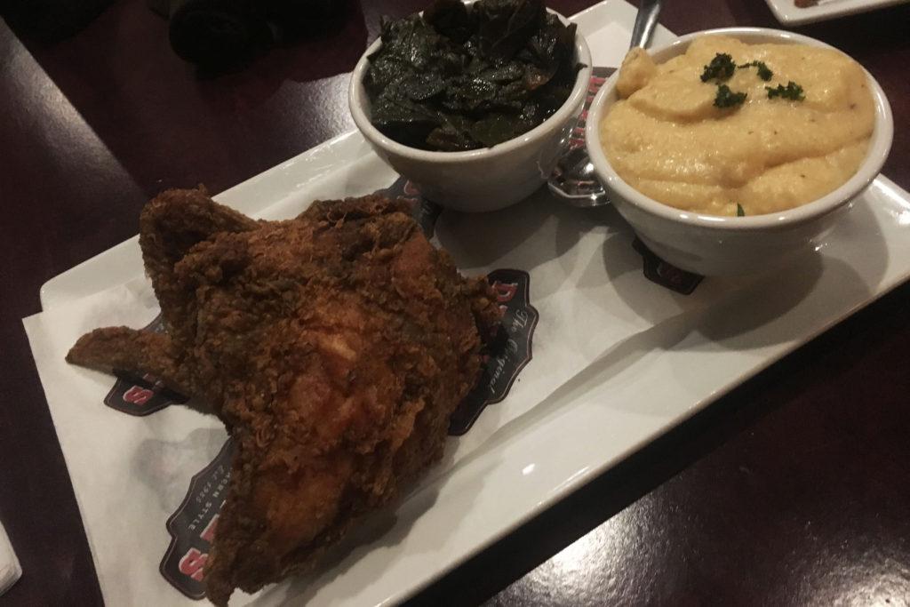 Fried chicken, collard greens and cheddar grits at Dixie’s on Grand. Photo by Kate Rhodes ’17.