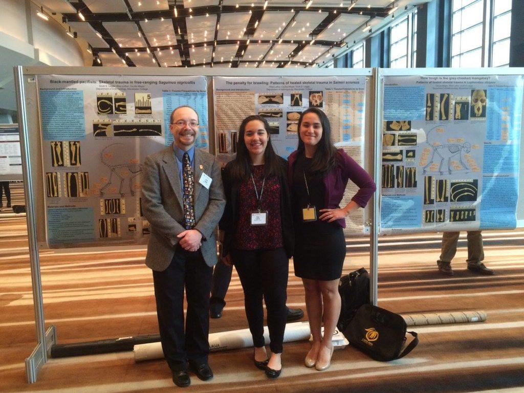 Associate Professor Scott Legge, Risa Luther ’16, and Cecilia Mayer ’16 pose at the 2016 American Association of Physical Anthropologists meeting in Atlanta with their research posters. Photo courtesy of Mayer. 