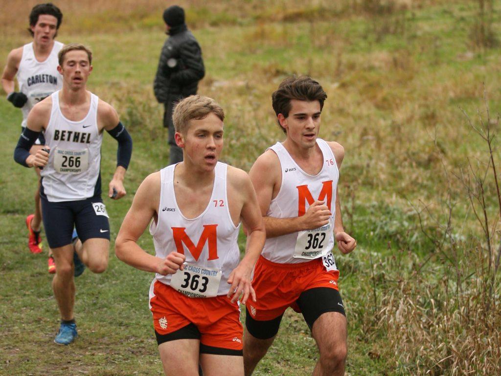 Adrian Johnson ’21 and Peter Jarka-Sellers ’20 run in the MIAC Championship. Both runners scored for Macalester, with a 50th place finish for Jarka-Sellers and a 63rd place finish for Johnson. Macalester finished seventh out of 11 teams. Photo courtesy of Bill Lepak.