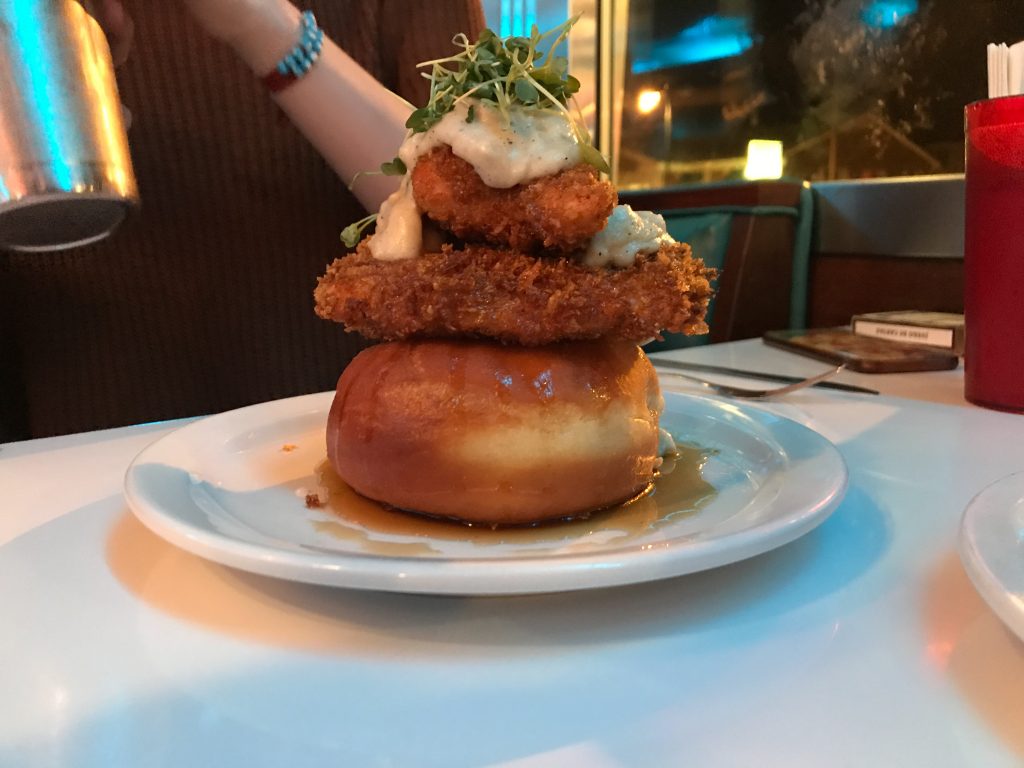 The Gary Cooper Hi Top, a giant donut topped with fried chicken, maple bourbon syrup, country gravy and micro arugula. Photo by Alexander Brahm ’20.