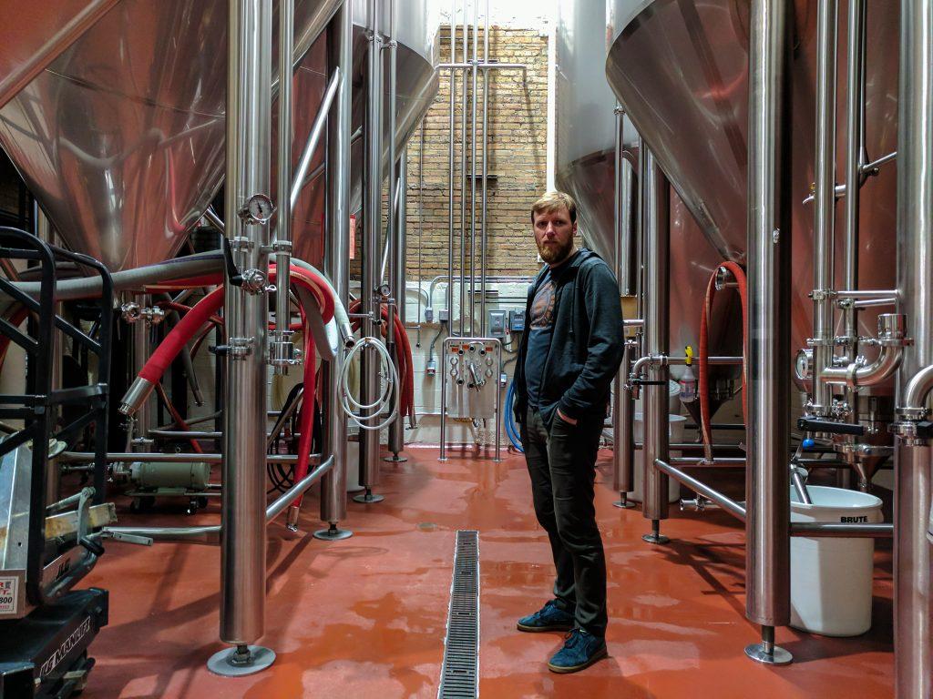 Co-owner Tom Whisenand in Indeed Brewery’s taproom. Photo by Henry Nieberg '19.