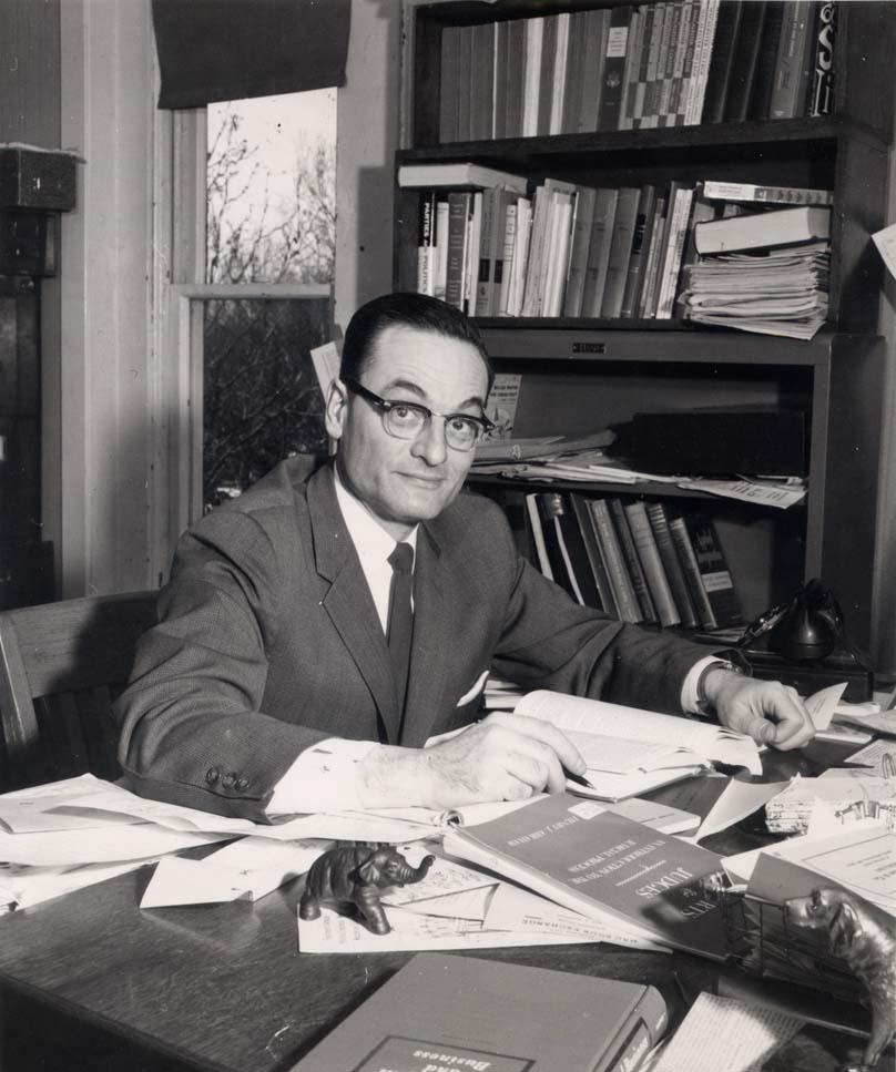 Mitau at his desk at Macalester. Photo courtesy of Macalester archives.