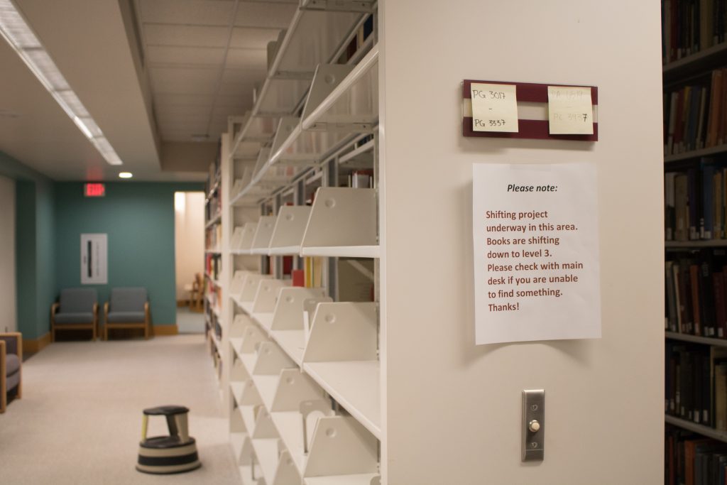 An empty bookshelf on the fourth level of the library. Photo by Josh Koh ’18