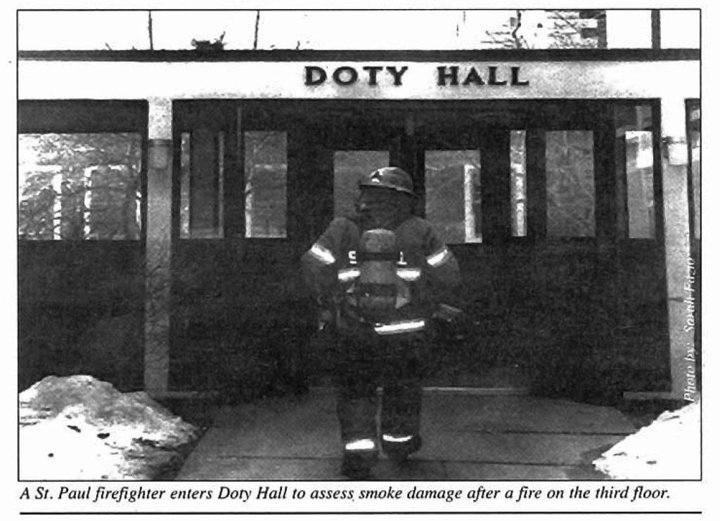 A fireman enter Doty Hall after a fire in 2001. Photo courtesy of Macalester Archives. 