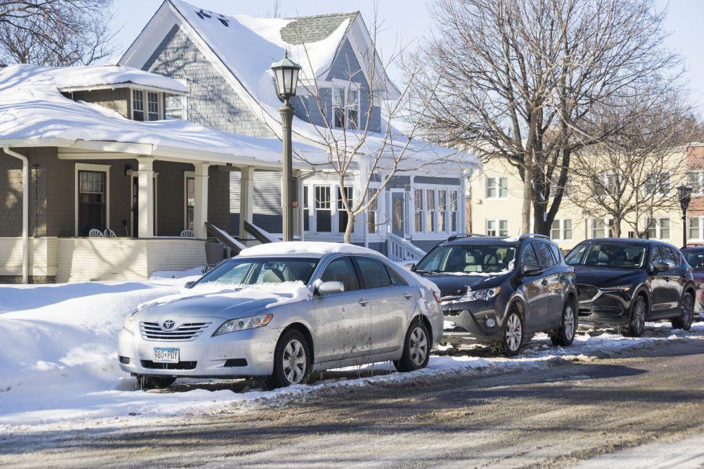 Street parking is a free-for-all during February’s snow emergencies. At Macalester, many have been ticketed or towed for illegal parking. Photo by Summer Xu ’20.