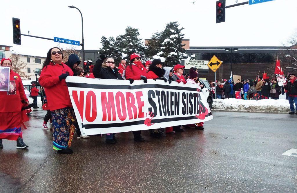 A group of protesters march outside of the Minneapolis American Indian Center. Photo by Estelle Timar-Wilcox ’22.
