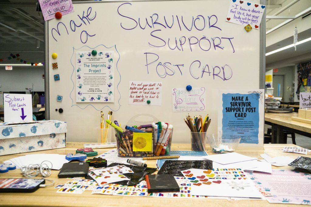 Supplies to make postcards for survivor support in the Idea Lab. Photo by Summer Xu ’20.