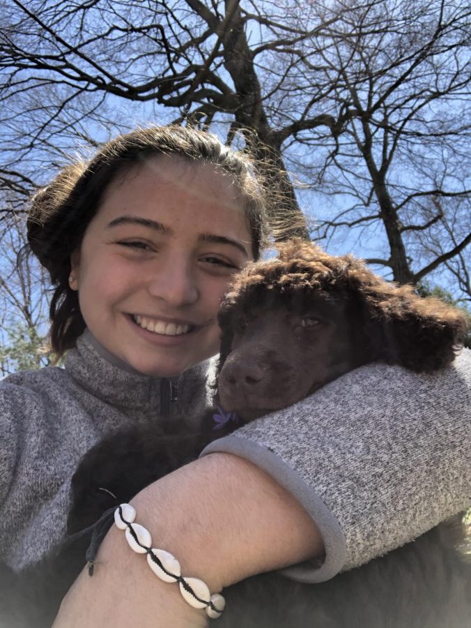 Lily Cooper '23 with new puppy Otis. Photo courtesy of Cooper.