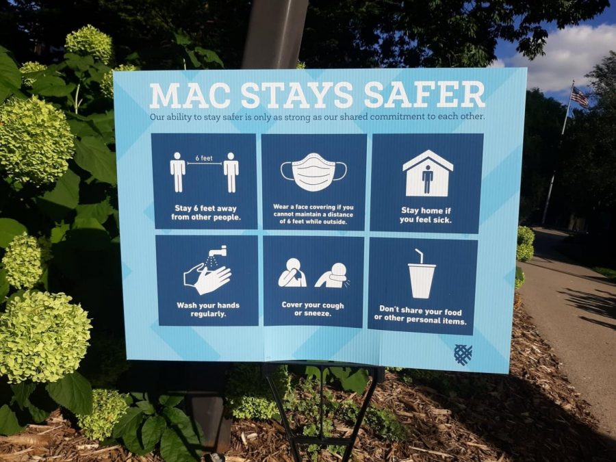 New “Mac Stays Safer” signs with social distancing guidelines are posted around campus in preparation for some students to arrive this fall. Photo by Estelle Timar-Wilcox ’22.