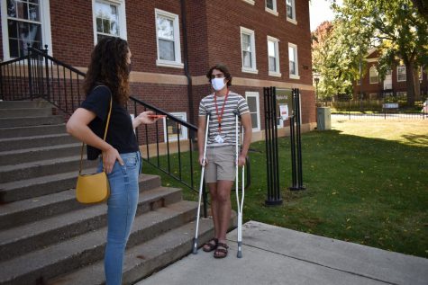 Mac Weekly reporter Margaret Moran 21 interviews Sami Banat 24. Photo by Lindsay Weber 21.