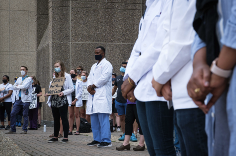 Medical students at the University of Minnesota hold a protest to speak out against former classmate Daniel Michelson, who was caught defacing the mural at the George Floyd Memorial, on August 27, 2020. Photo by Kori Suzuki 21.