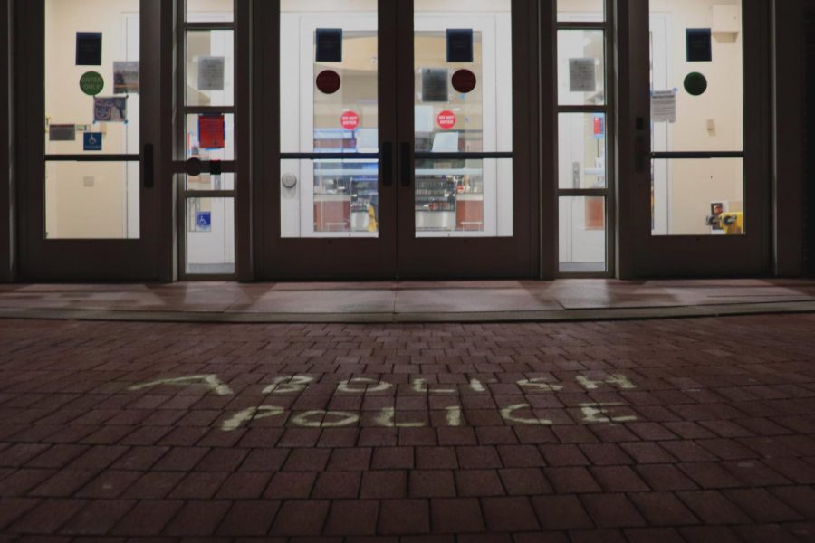 Chalk writing outside of the campus center calling for police abolition. Photo by Shosuke Noma ‘23.