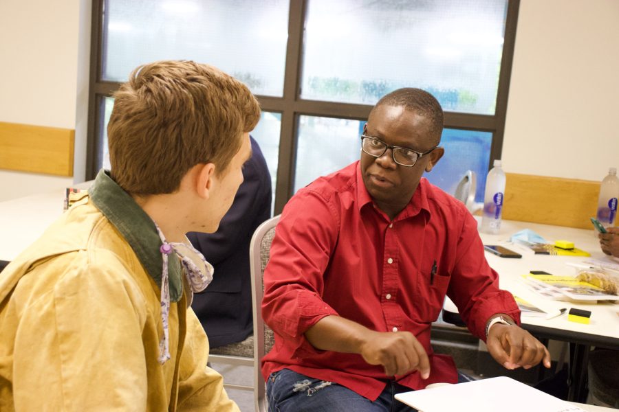 Matthew Wilkinson ’22 talks with Kiloloma Kisongo, one of the leaders of Voices in the Wilderness. Photo by Leen Diab ’22, contributing photographer.