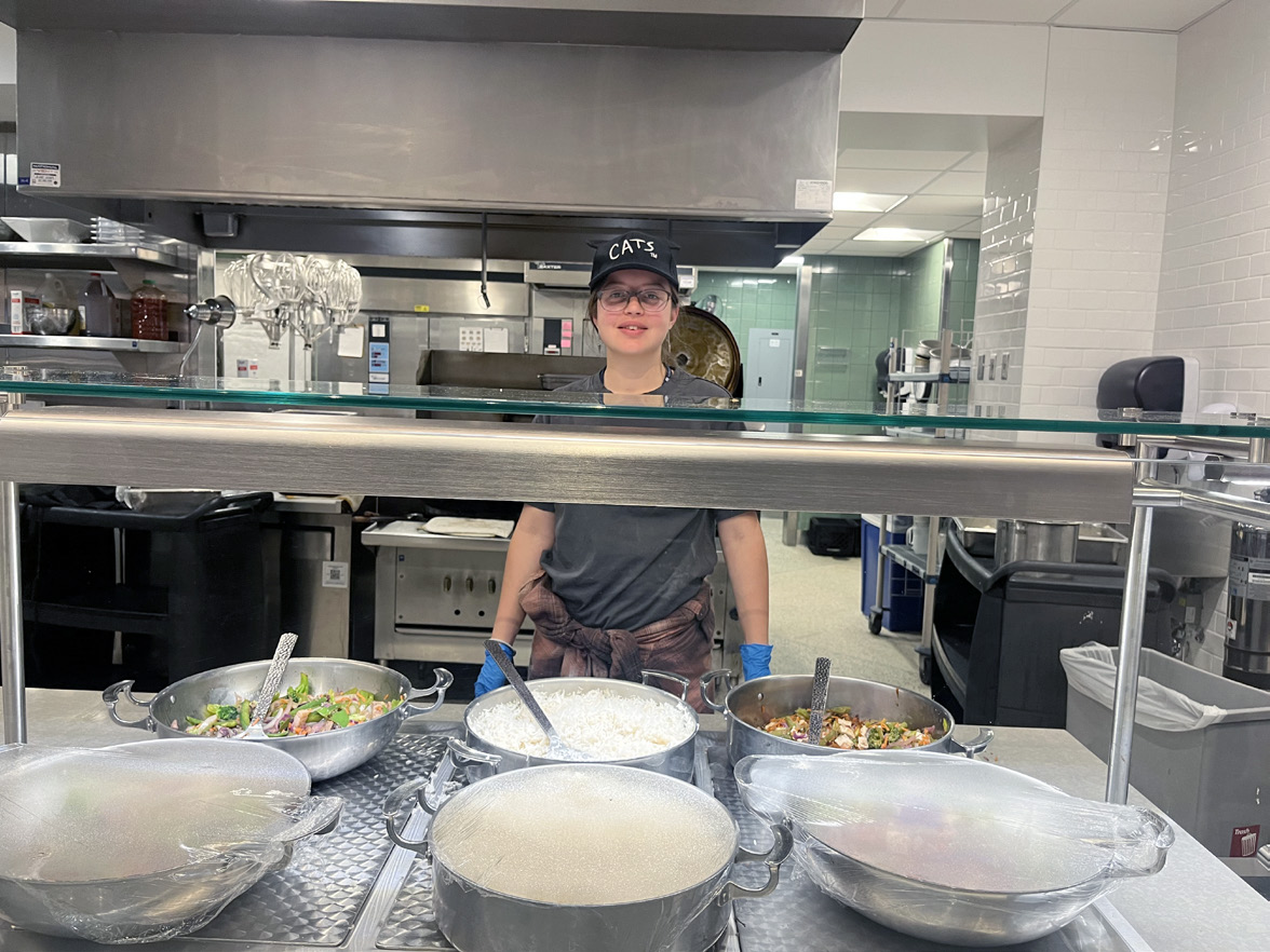 Milana Krishnevsky '28 working at Cafe Mac.