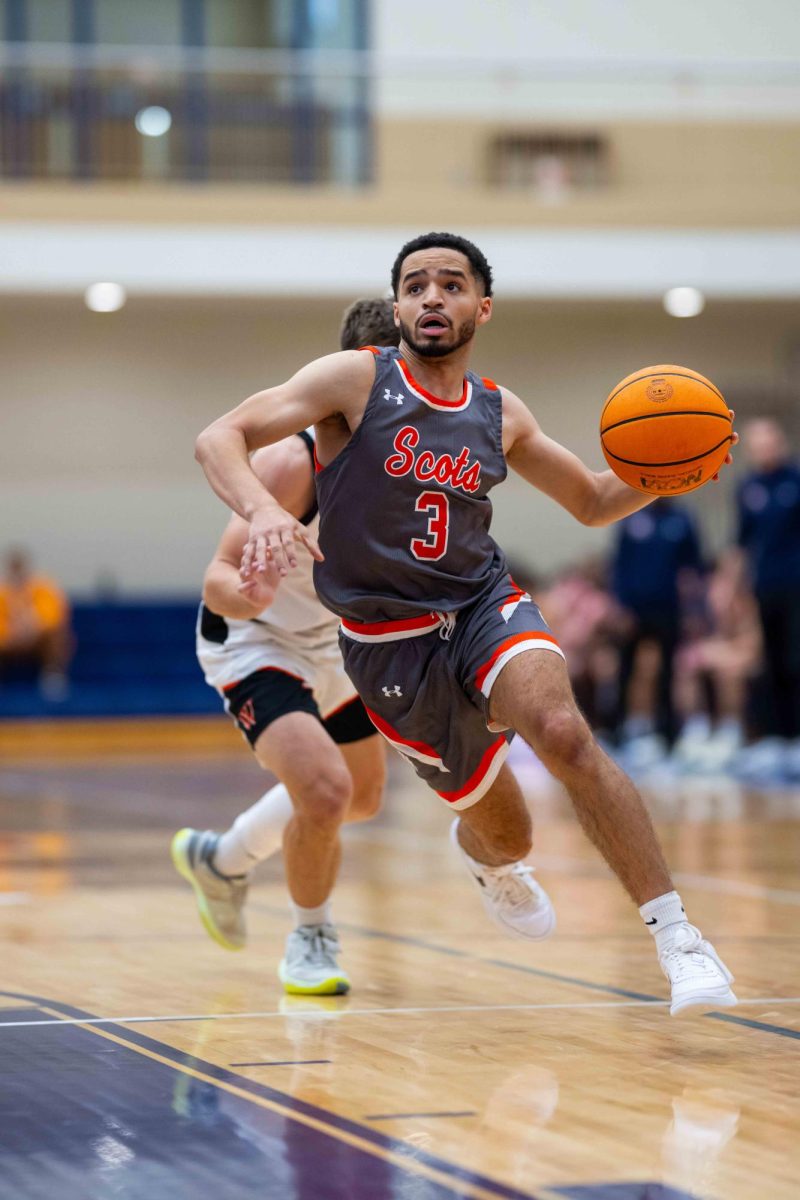 Robert Grace IV ’25 drives against Wartburg. Photo ourtesy of Mac Athletics.