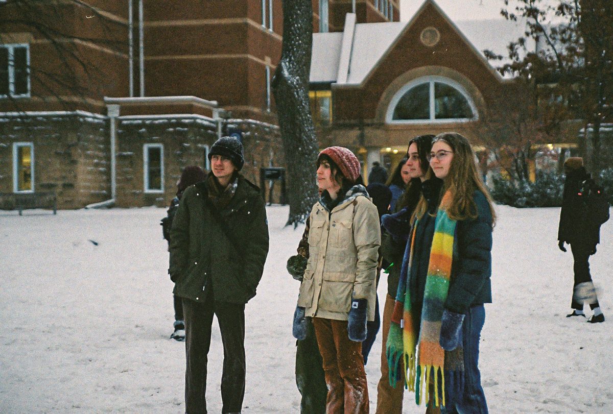 Mac students witness big snowball fight on Great Lawn.